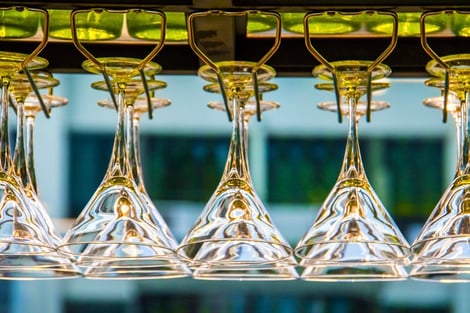 photo-indistinguishable wine classes hanging on rack
